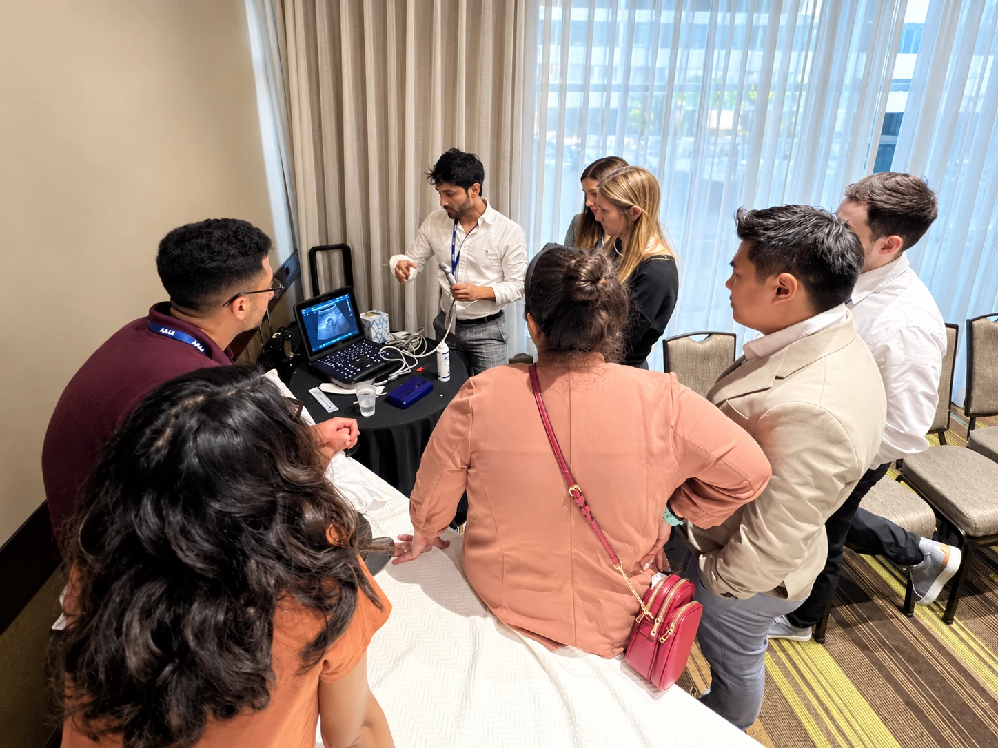 Participants gathered for hands-on ultrasound teaching.