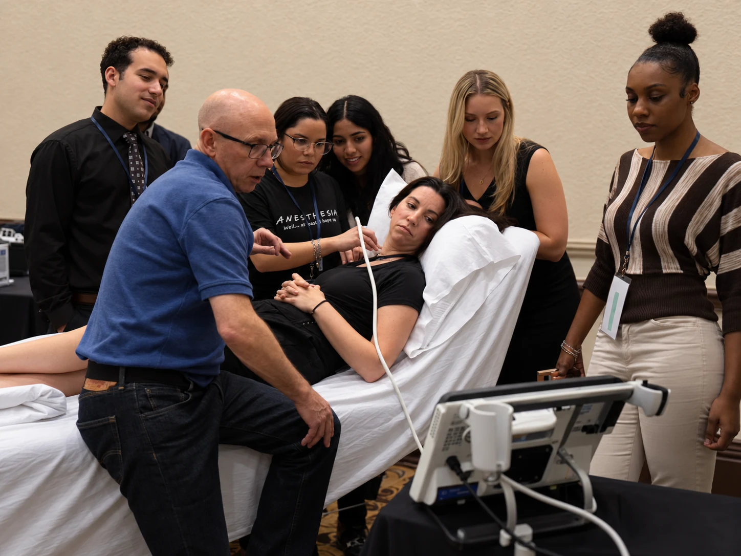 Block GuRU faculty teaching ultrasound scanning to a small group